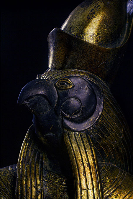 close-up photo of a Horus statue against a black background