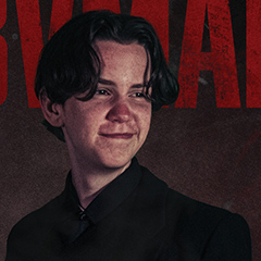 thumbnail of a kid in black